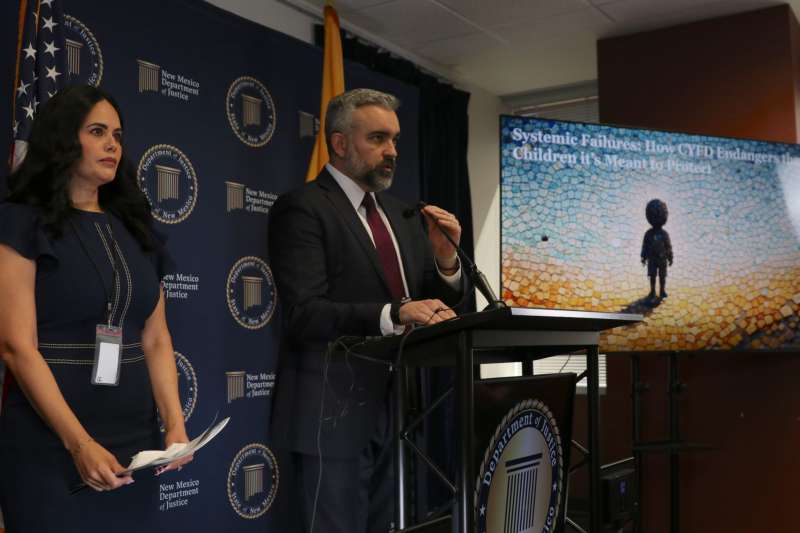 New Mexico Attorney General Raúl Torrez, pictured on April 8, 2026, alongside the surviving aunt of a teenager who killed himself in 2025 while in state custody, at a news conference to announce the results of his agency’s investigation into the state Children, Youth and Families Department. (Danielle Prokop/Source NM)