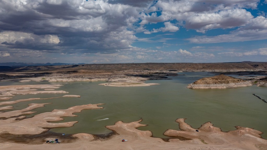 A drone photo shows Rattlesnake Island, at right, and the high-water marks etched into its shoreline at Elephant Butte Reservoir