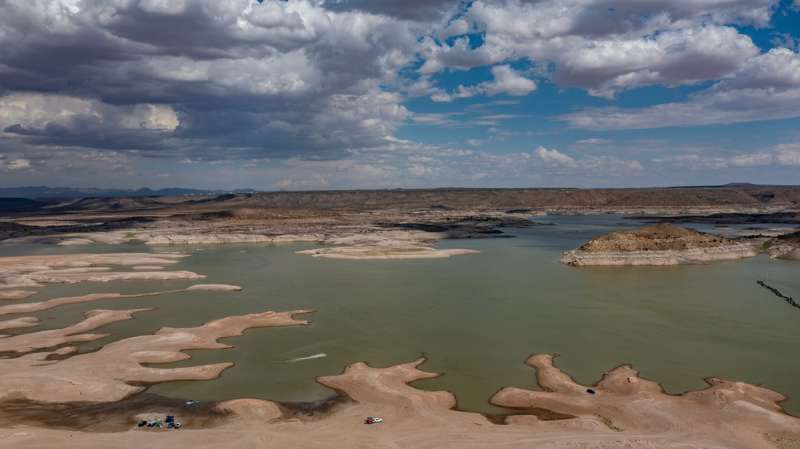A drone photo shows Rattlesnake Island, at right, and the high-water marks etched into its shoreline at Elephant Butte Reservoir