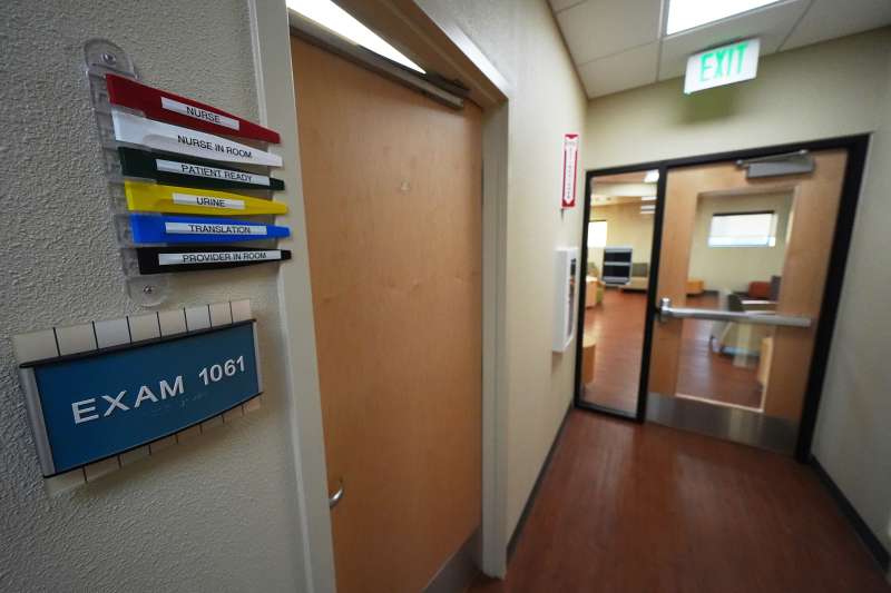 Signs are visible outside of a clinic's exam room Monday, Feb. 24, 2025, in Hobbs, N.M. (AP Photo/Julio Cortez)